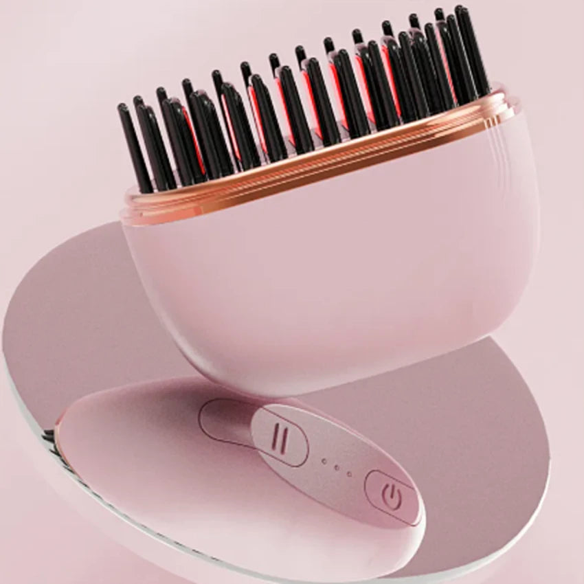 Peine rosa con el calentamiento activo y los botones de control